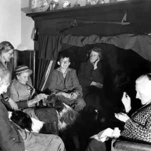 A group of elderly people and their dogs gathered together in a house in Sussex, England A group of elderly people and their dogs gathered together in a house in Sussex, England