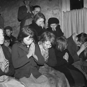 Gypsy childrens Sunday school in the cow shed in St Mary Cray. Children praying Gypsy childrens Sunday school in the cow shed in St Mary Cray. Children praying