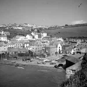 Harbour with boats at Port Isaacs, Cornwall, England, UK 1960s Fish where the fish are