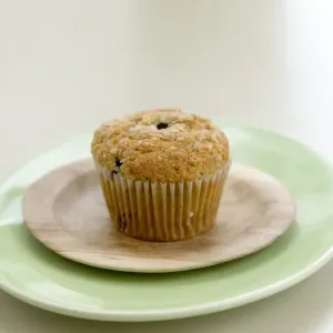 Healthy bran and raisin muffin on small wooden plate on green platter credit: Marie-Louise Healthy bran and raisin muffin on small wooden plate on green platter credit: Marie-Louise