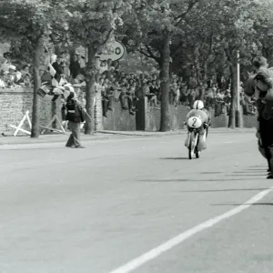 Isle Of Man: German motor cycle racder Ernst Degner riding a 50 c. c. Japanese Suzuki