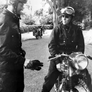 Isle of man, United Kingdom: wearing black leather racing gear, Lord Snowdon, husband Isle of man, United Kingdom: wearing black leather racing gear, Lord Snowdon, husband