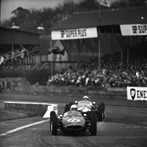 John Surtees 11 and Stirling Moss 7 racing in the Goodwood International 100 for the Glover Trophy