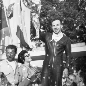 John Surtees acknowledges the cheers of the crowd after his second victory at Monza Italy