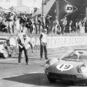 John Surtees in his Ferrari leading after 33 laps
