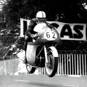 Print of a motorcycle in mid-air over Ballaugh Bridge Print of a motorcycle in mid-air over Ballaugh Bridge