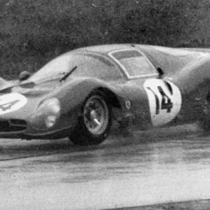 John Surtees pictured in action in heavy rain at the 1000 km Monza International race