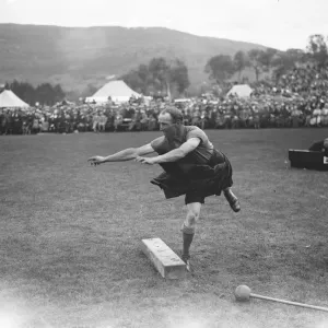 King and Queen at Braemar gathering. D K Michie, winner of putting the 28 lb stone