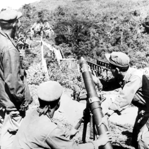 Laos: Royal Laotian soldiers ready for action with an 81mm mortar from a position