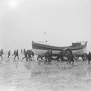 Lifeboat launched by Motor Tractor. Horses replaced by water tight machinery An