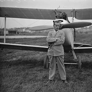 London to Capetown by Moth. Captain Bentley standing in front of his machine. 30