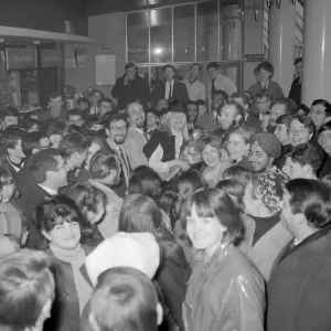 London : Fans surround folk singers Peter ( with glasses ), Paul and Mary as they