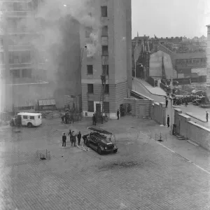 A London Fire Brigade display in Lambeth, London. Firemen use extension ladders A London Fire Brigade display in Lambeth, London. Firemen use extension ladders