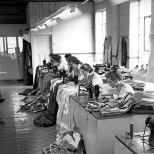 London Girl workers at an Old Kent Road Flag and Decorations making factory sew pieces