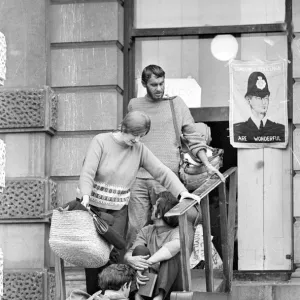 London: A women and child is assisted by squatters to enter the empty 60 room mansion a 144