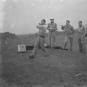 Members of Arsenal Football Club on the Dyke golf links at Brighton. Cliff Bastin driving off