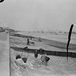 Members of the public relax on the opened beaches of the river Thames in Gravesend