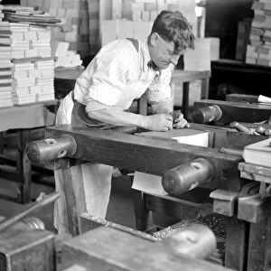 At Messrs James Burns Book Binding works at Esher. Gilding the edge. 15 May 1923