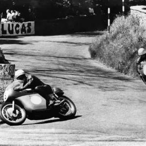 A black and white print of two motorcyclists racing on the Isle of Man A black and white print of two motorcyclists racing on the Isle of Man