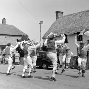 Morris Dancing in the street in Dorset, England, UK 1960 s