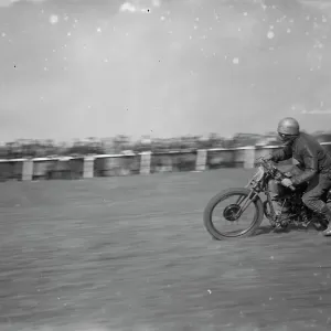 Motor cycling races at Brands Hatch. A scramblers takes the bend. 1936 Motor cycling races at Brands Hatch. A scramblers takes the bend. 1936
