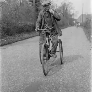 Mr Charles Johnson on a tricycle in Kingsdown, Kent. 1937