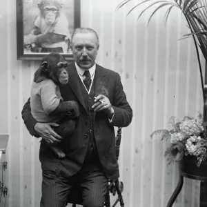 Print of a chimpanzee accompanying Mr Cherry Kearton in a film lecture Print of a chimpanzee accompanying Mr Cherry Kearton in a film lecture