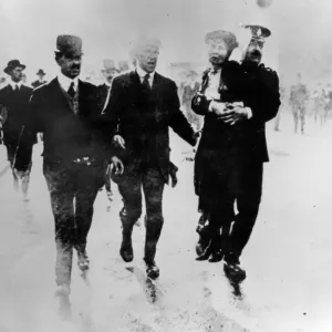 Mrs Emmeline Pankhurst is lifted off the ground by a policeman during a demonstration