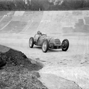 Mrs Wisdom practises at Brooklands. Preparations for international trophy race