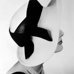 Named Vanity Fayre, this attractive summer hat is in white paribuntal straw Named Vanity Fayre, this attractive summer hat is in white paribuntal straw