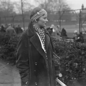 New fashion in tennis headwear. Miss J Mc Alpine plays with watch in bandou New fashion in tennis headwear. Miss J Mc Alpine plays with watch in bandou