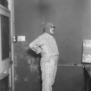 A new suit for flying men. It won t burn, won t sink and keeps out the cold A new suit for flying men. It won t burn, won t sink and keeps out the cold