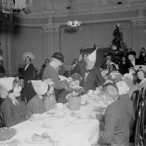 The Old Contemptibles childrens party. Serving the children their party food The Old Contemptibles childrens party. Serving the children their party food