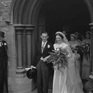 An old fashion wedding at Eltham Parish church. The bride and groom leaving the church