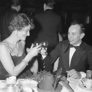 Black and white print of John Surtees toasting at Talk of the Town