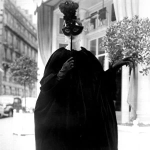 Paris: Reminiscent of the Venetian Domino is this evening cloak, entitled Panach, by Yves St