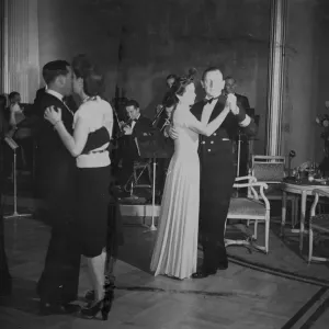 Passengers on the maiden voyage of the HMS Queen Elizabeth luxury liner, dancing