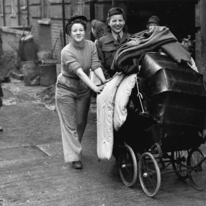 Photo shows: Miss Evyline Nichol and her ATS friend Audrey Towend wheeling a pram Photo shows: Miss Evyline Nichol and her ATS friend Audrey Towend wheeling a pram
