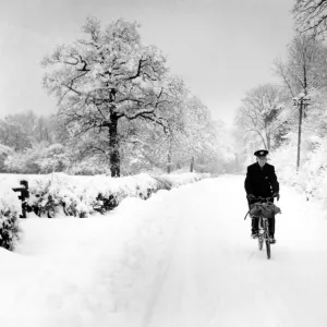 Postman cycling through snow in Bough Beech, Kent. 28th December 1962