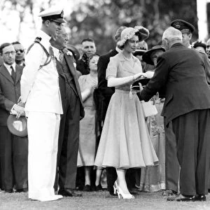 Princess Elizabeth receives the key and title deeds of Royal Lodge from Mr W. K. Horne