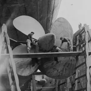 The Queen Elizabeth in dry dock. After hold-up at 12 hours due to unfavourable weather The Queen Elizabeth in dry dock. After hold-up at 12 hours due to unfavourable weather