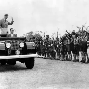 Queen Elizabeth II and the Duke of Edinburgh wave smiling acknowlegements of Queen Elizabeth II and the Duke of Edinburgh wave smiling acknowlegements of