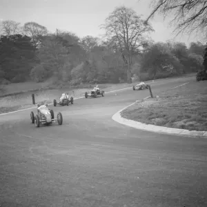 Race cars take the Pond hair pin. 1938 Crystal Palace