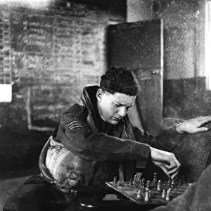 RAF fighter pilot of 602 Squadron at dispersal - playing chess while waiting for