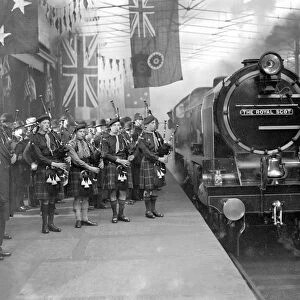 Royal Scot steaming into Euston, serenaded by the pipes, for her public exhibition