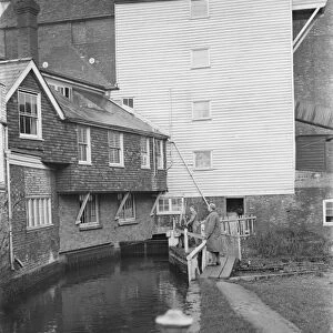 S O Garnham at the water powered, flour East Hill Mill in Ashford, Kent, which