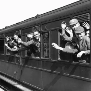 Print of schoolboys waving on a train between the wars Print of schoolboys waving on a train between the wars