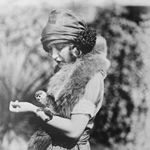 Smallest monkey in captivity. Miss Ruth Clifford, who bears a marked resemblance
