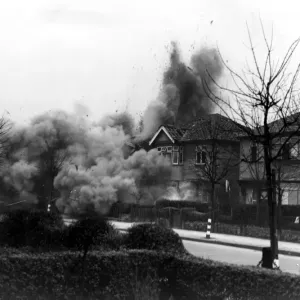 Smoke and debris thrown skywards after a direct hit from a German bomb in the suburbs Smoke and debris thrown skywards after a direct hit from a German bomb in the suburbs