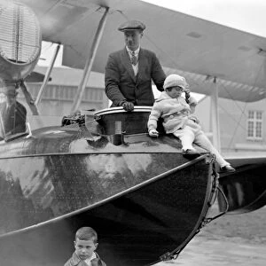 Squadron Leader Archibald Stuart MacLaren and his daughter standing in the Vickers